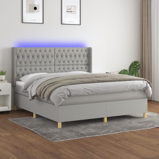 Box spring postelja z vzmetnico LED sv. siva 160x200 cm blago