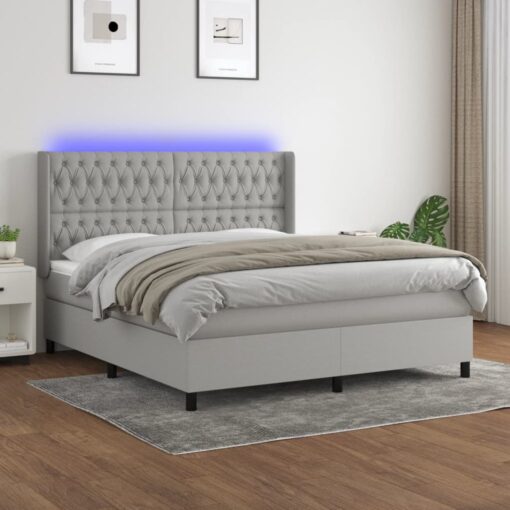 Box spring postelja z vzmetnico LED sv. siva 180x200 cm blago