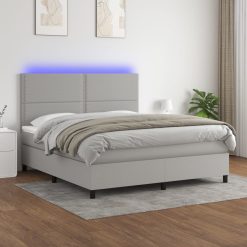 Box spring postelja z vzmetnico LED sv. siva 160x200 cm blago