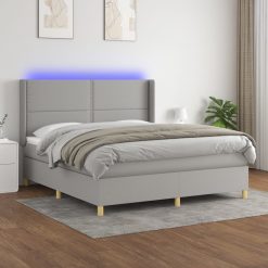 Box spring postelja z vzmetnico LED sv. siva 160x200 cm blago